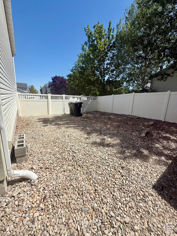 View of fenced backyard