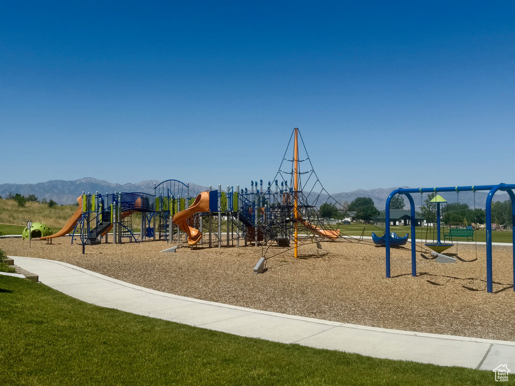 Community playground featuring a mountain view