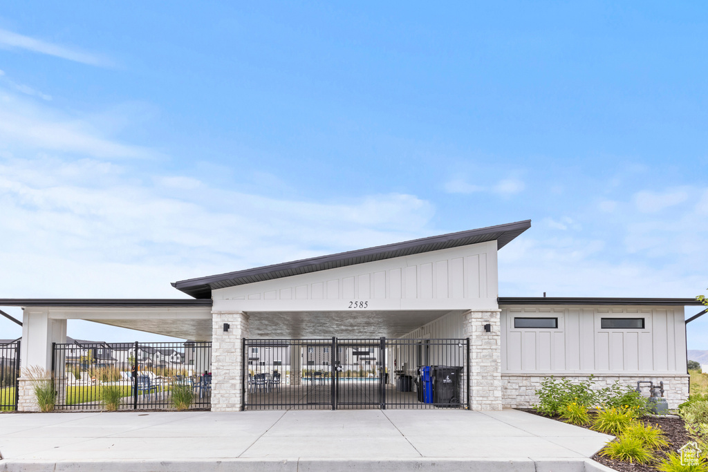 View of building exterior with a fenced front yard
