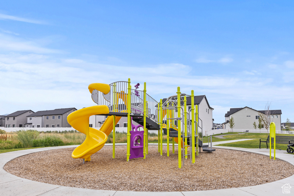 Community playground featuring a residential view
