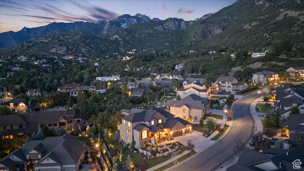 View of property location featuring a mountainous background and nearby suburban area