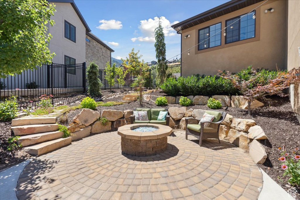View of patio / terrace with a fire pit