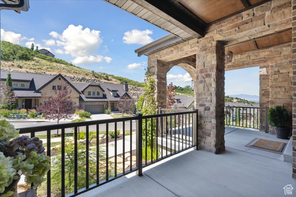 Balcony with a residential view and a mountain view