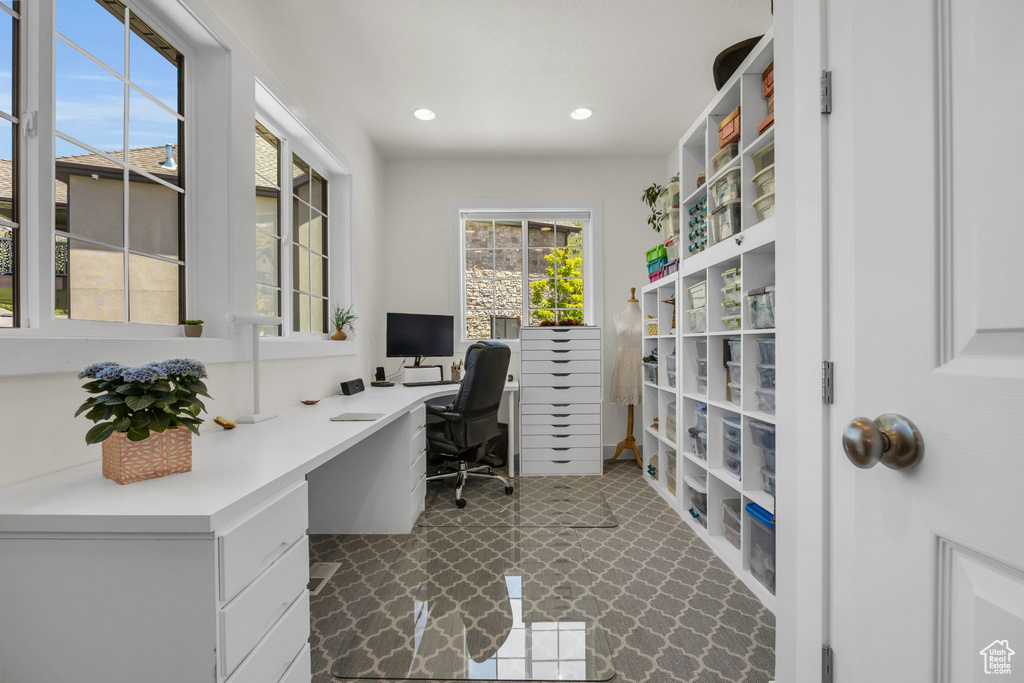 Office space featuring recessed lighting and dark flooring