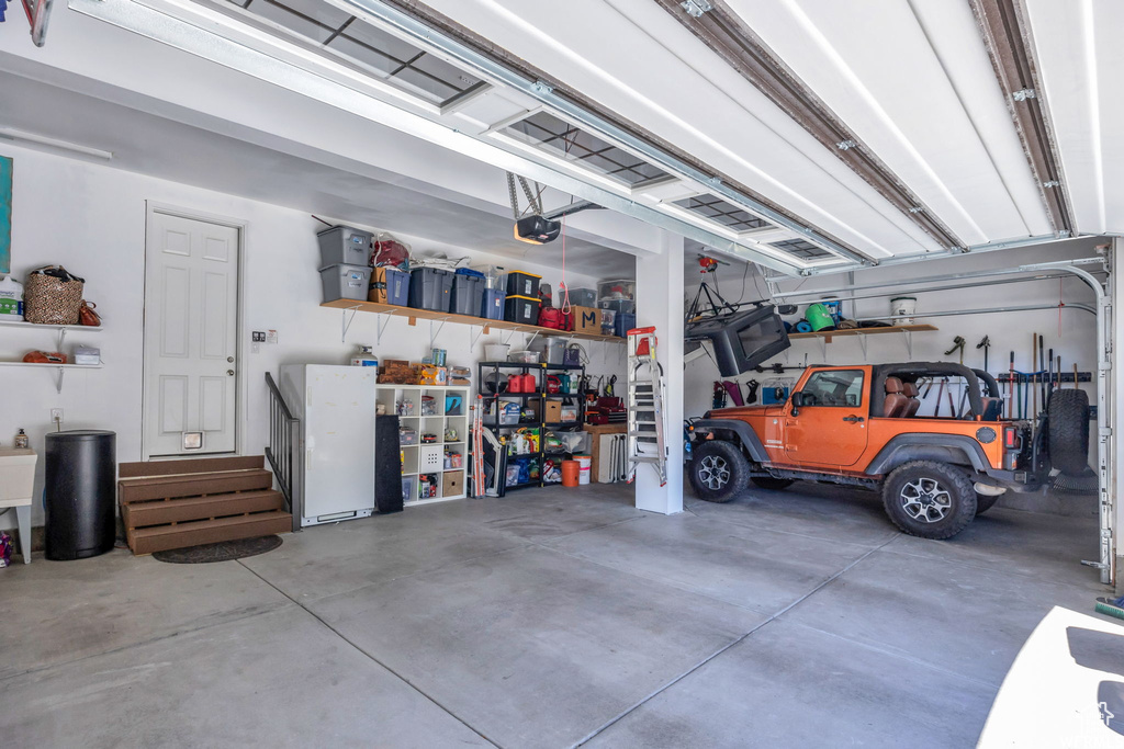 Garage featuring a garage door opener