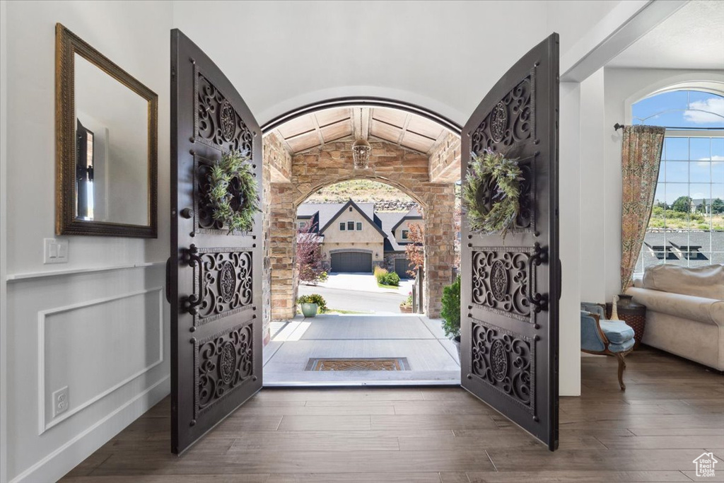 Entrance foyer with hardwood / wood-style flooring