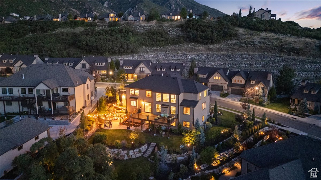 Aerial view at dusk of a residential view and a mountain view
