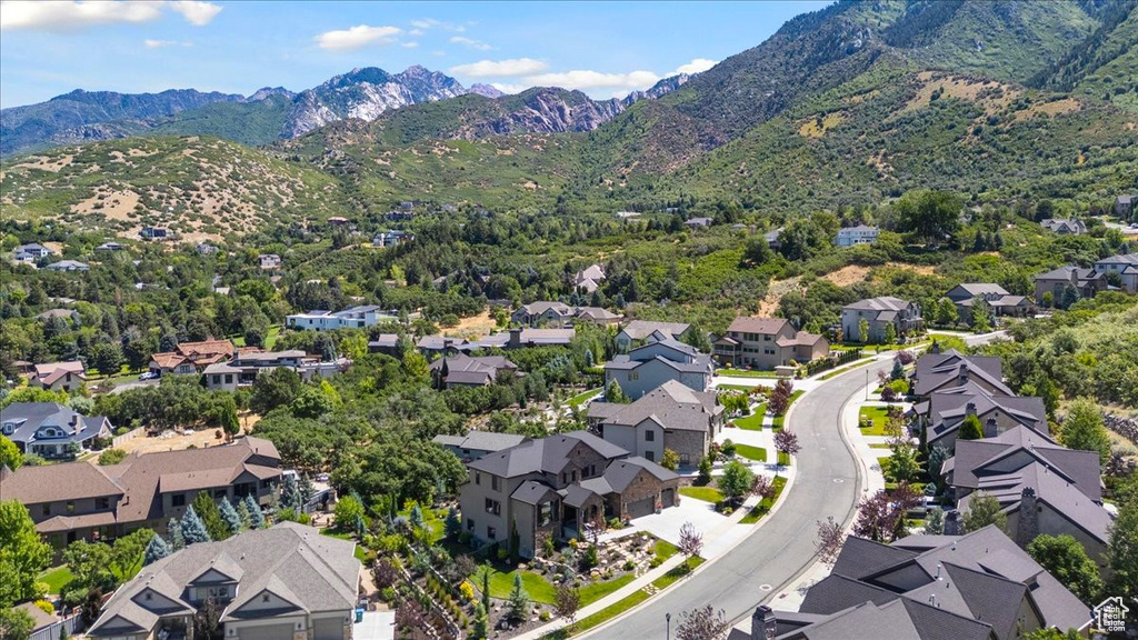 Aerial view of residential area featuring mountains