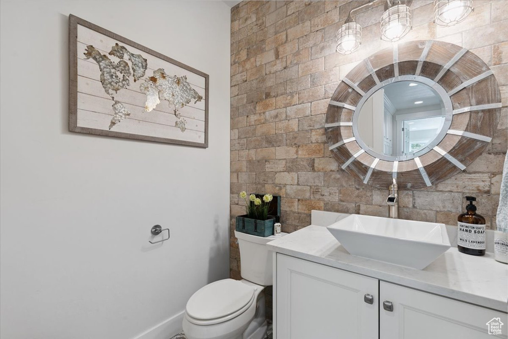 Bathroom featuring vanity and toilet