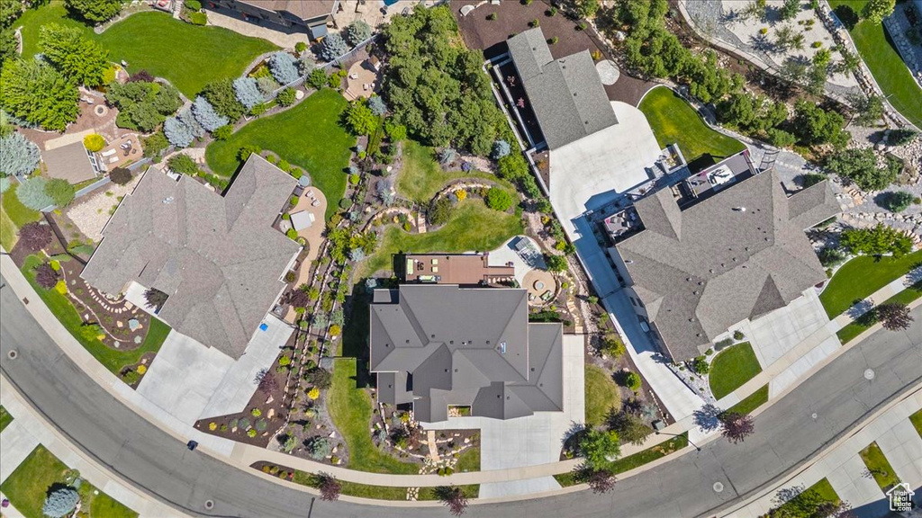 Aerial view of property and surrounding area featuring nearby suburban area