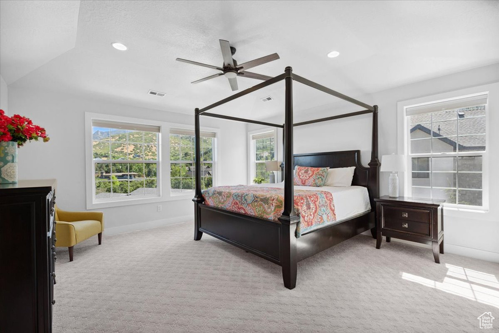 Bedroom featuring light colored carpet, recessed lighting, vaulted ceiling, and ceiling fan