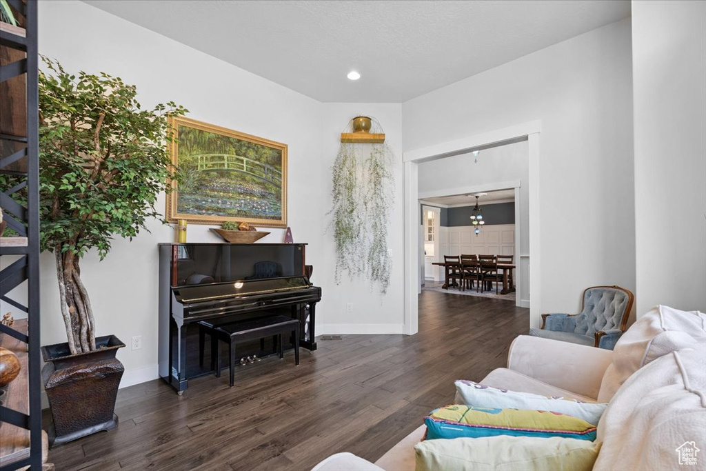 Living area with wood finished floors and recessed lighting