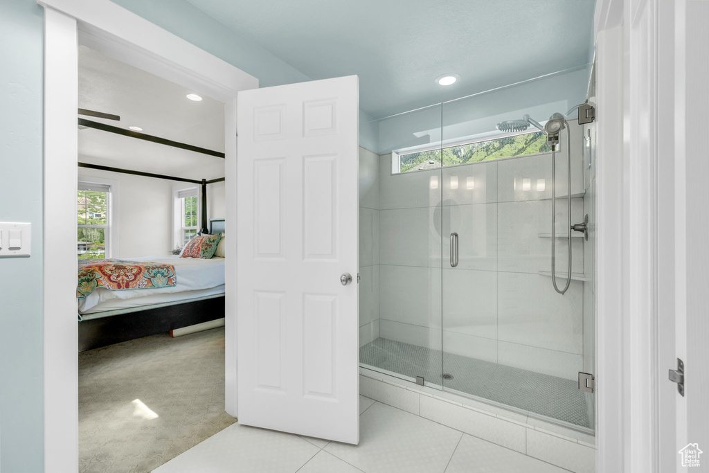 Full bathroom with connected bathroom, a shower stall, tile patterned flooring, and recessed lighting