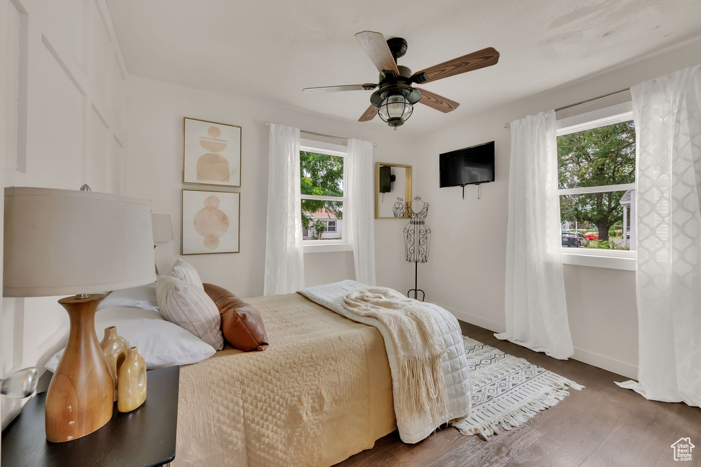 Bedroom with wood finished floors and a ceiling fan