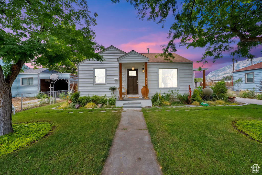 Bungalow-style house featuring a detached carport