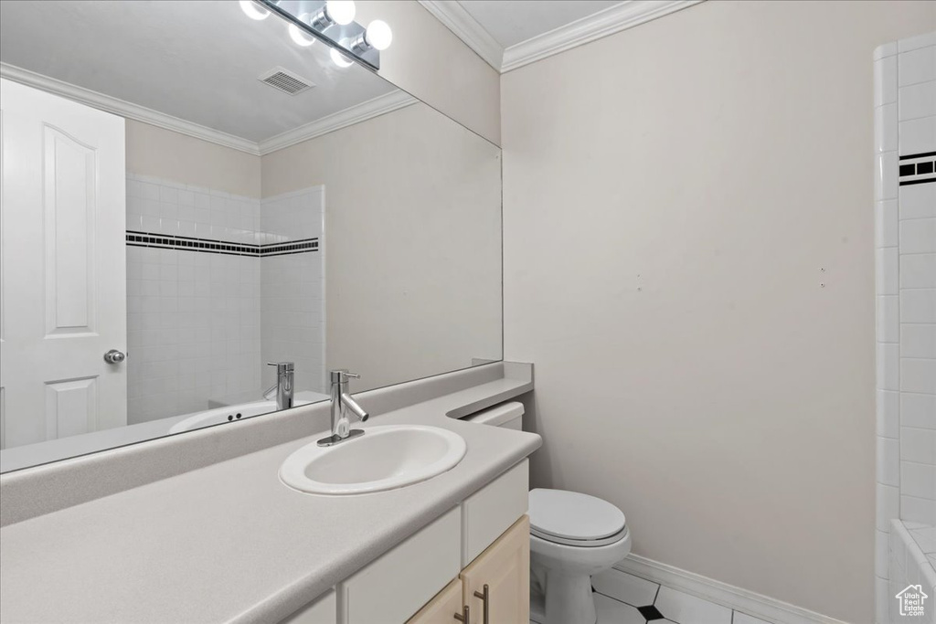 Full bathroom with vanity, a shower, ornamental molding, and tile patterned flooring