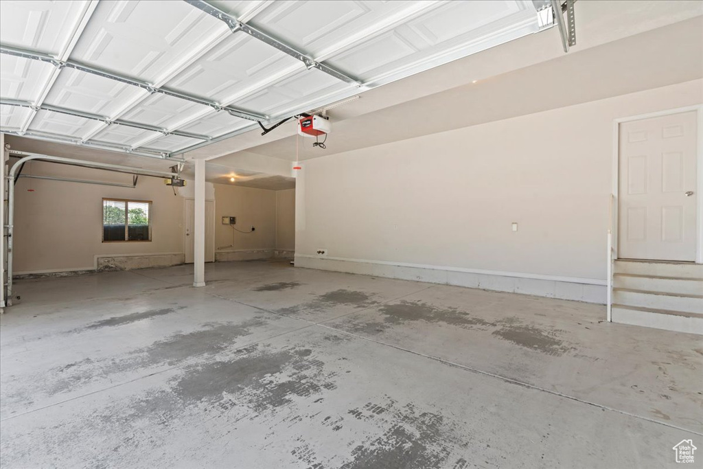 Garage featuring a garage door opener