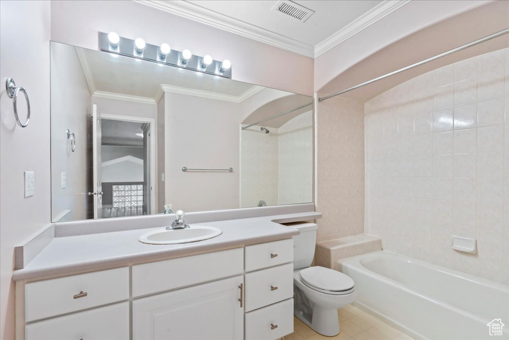 Full bathroom featuring vanity, shower / tub combination, crown molding, and tile patterned floors