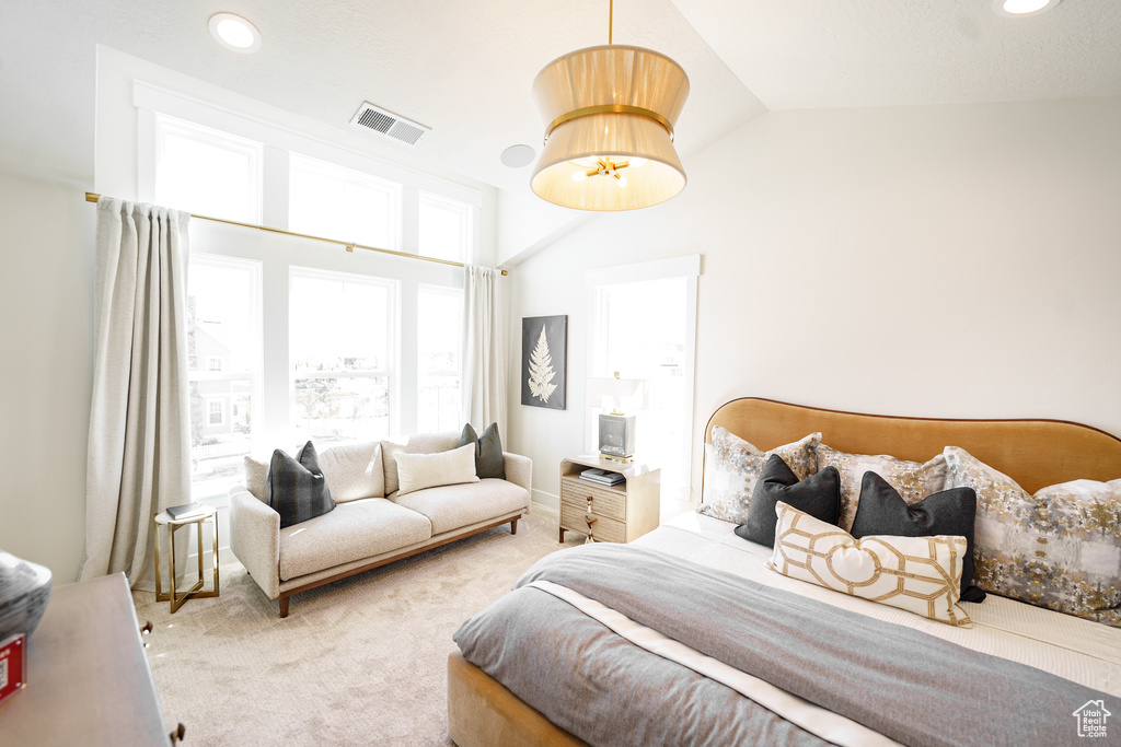Bedroom with carpet floors, vaulted ceiling, and recessed lighting