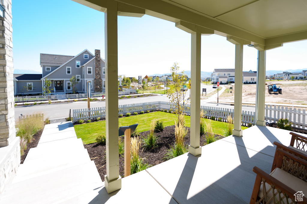 Covered porch with a residential view