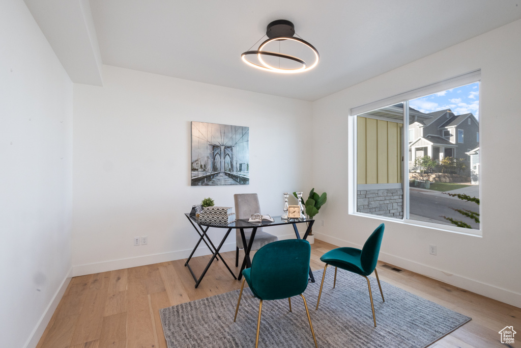 Office space featuring light wood-type flooring and baseboards