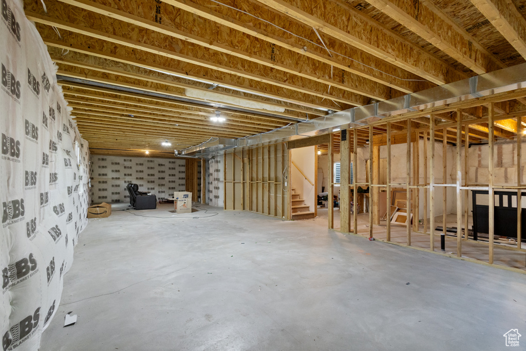 Unfinished basement with stairway