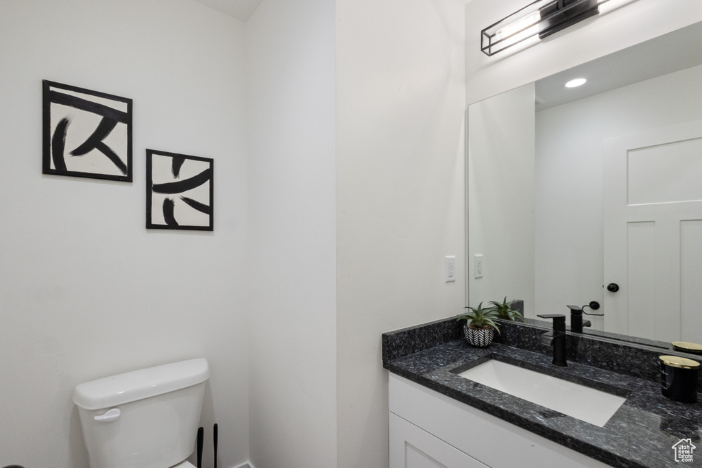 Half bath with toilet and vanity