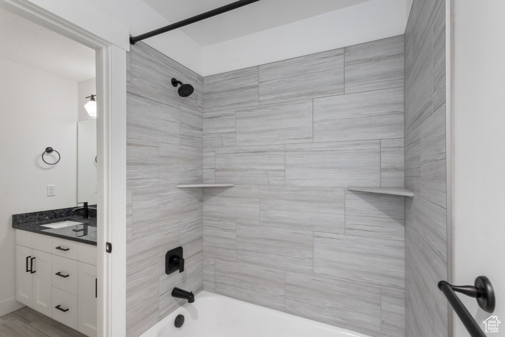 Bathroom featuring shower / bathtub combination and vanity