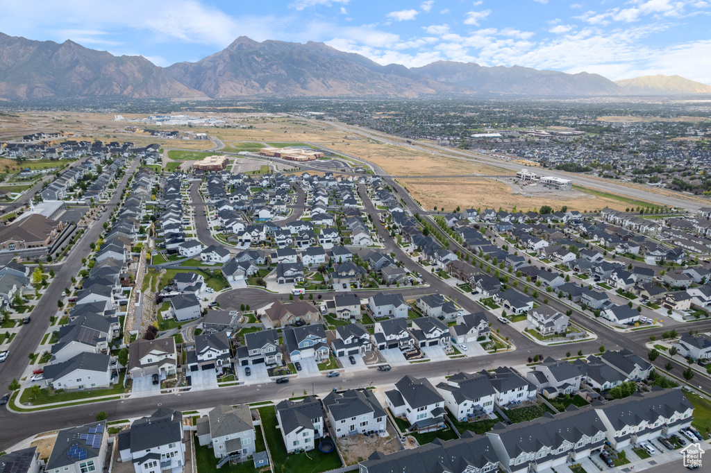View of property location featuring a mountainous background and nearby suburban area