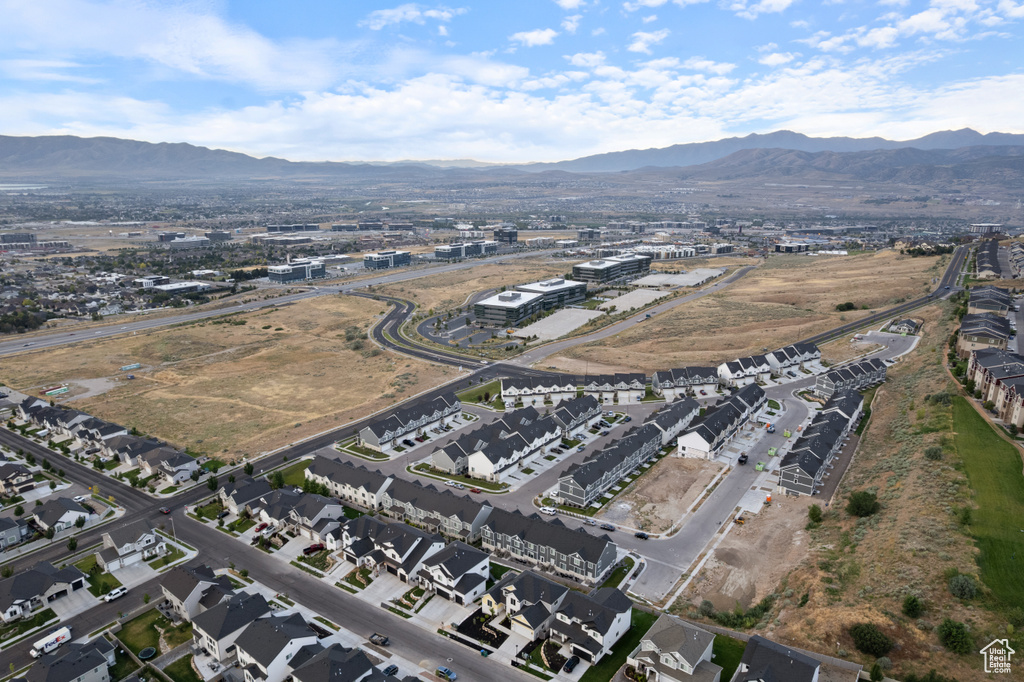 Aerial view of property\'s location with a mountainous background