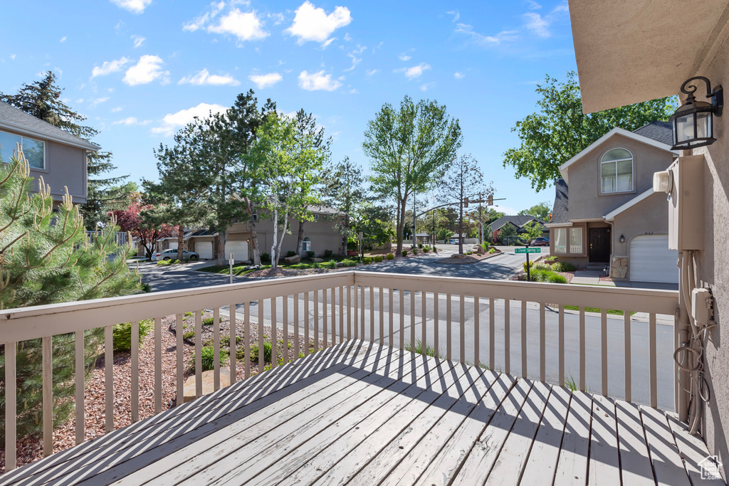 Wooden deck with a residential view