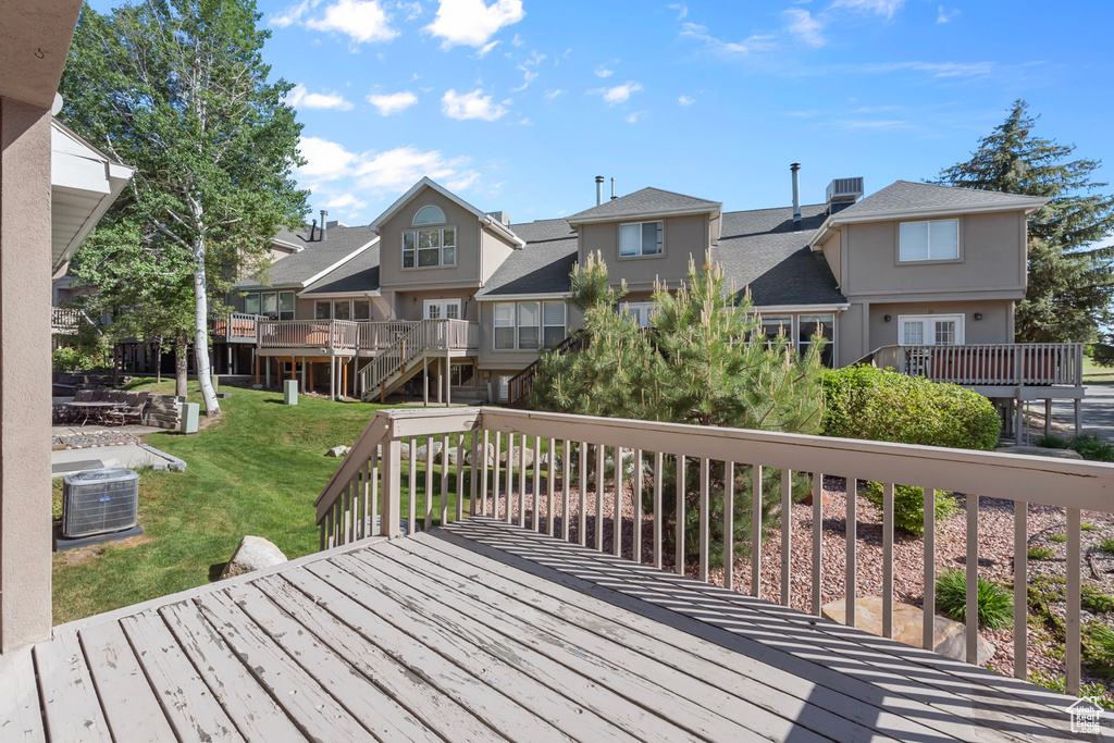 Deck featuring a residential view and a yard
