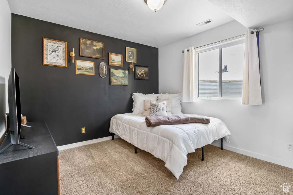Bedroom featuring carpet flooring