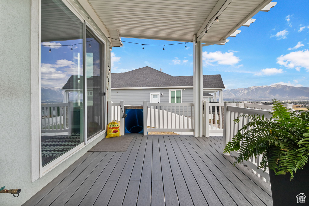 Wooden deck featuring a mountain view
