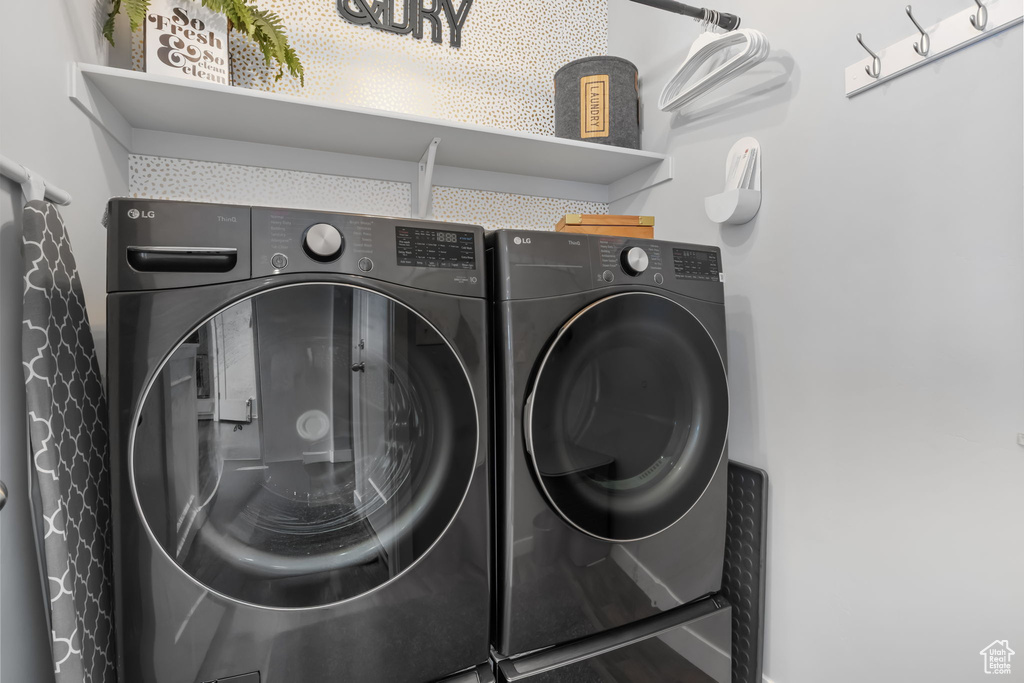 Laundry room featuring separate washer and dryer