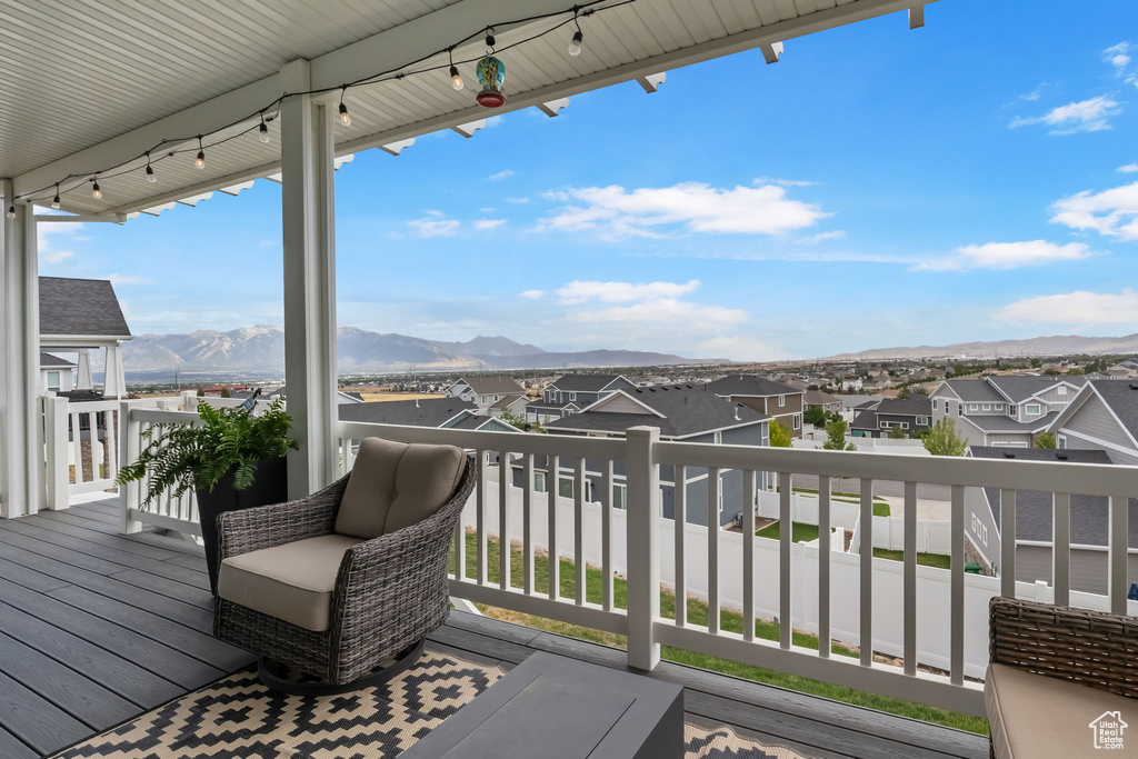 Wooden terrace with a mountain view and a residential view