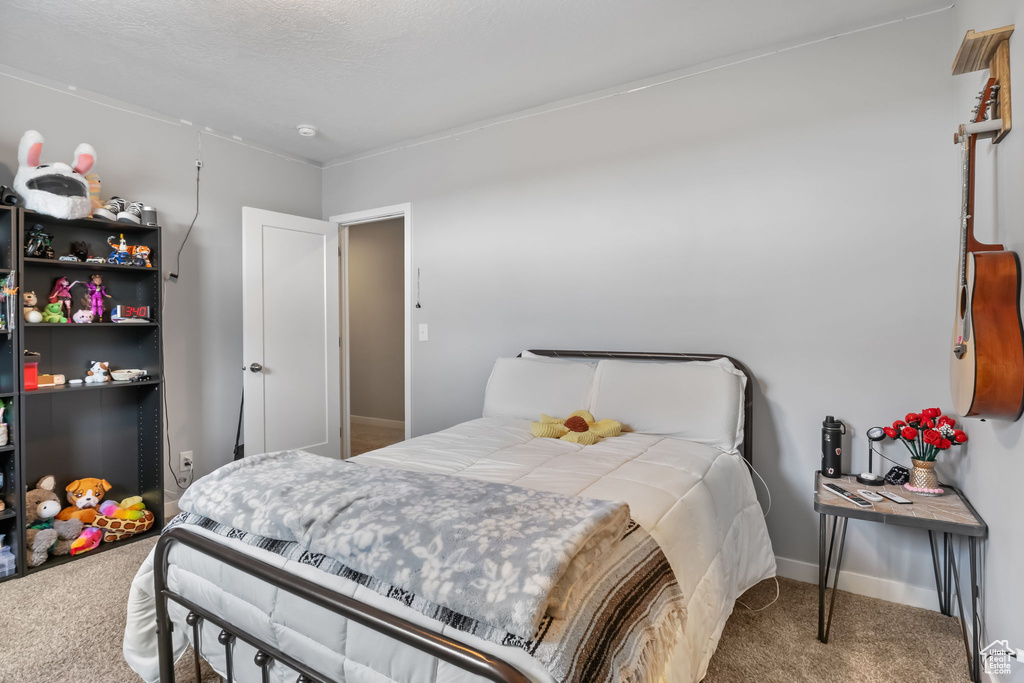 Bedroom featuring carpet floors
