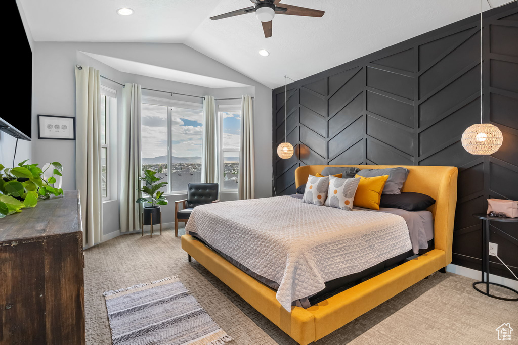 Carpeted bedroom with lofted ceiling, recessed lighting, and ceiling fan