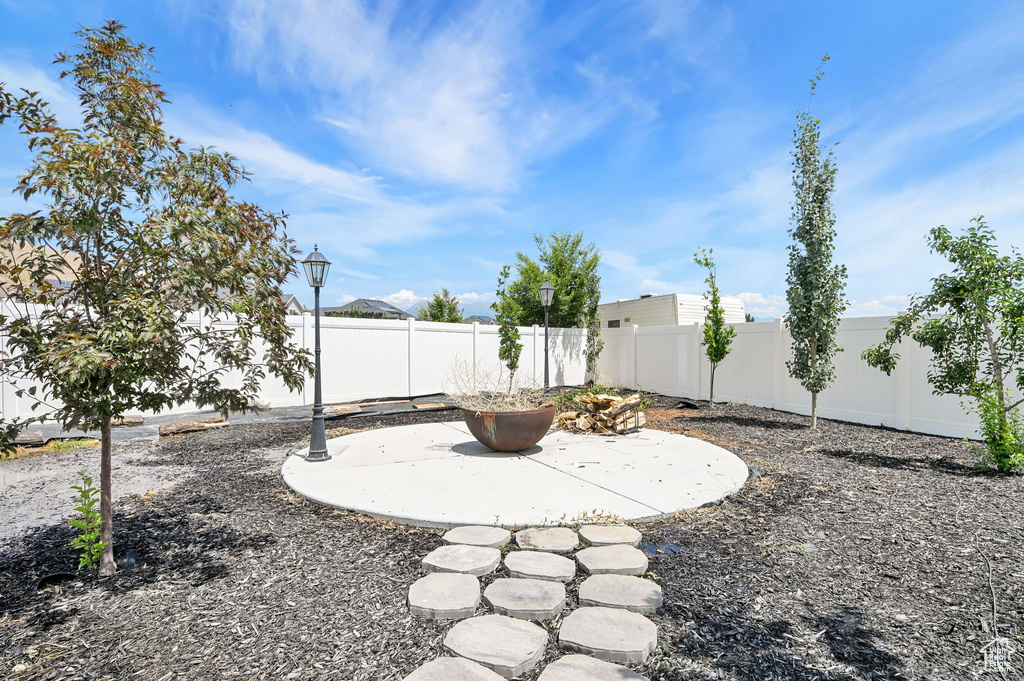 Fenced backyard with a patio area