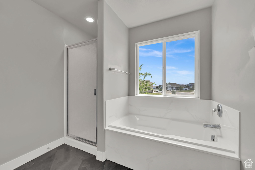 Bathroom with a shower stall, a garden tub, recessed lighting, and marble finish flooring