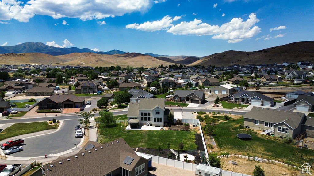 Aerial view of residential area featuring a mountain backdrop