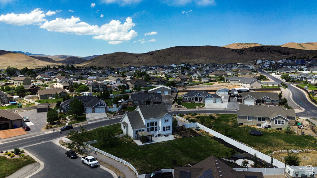 Aerial view of residential area featuring mountains