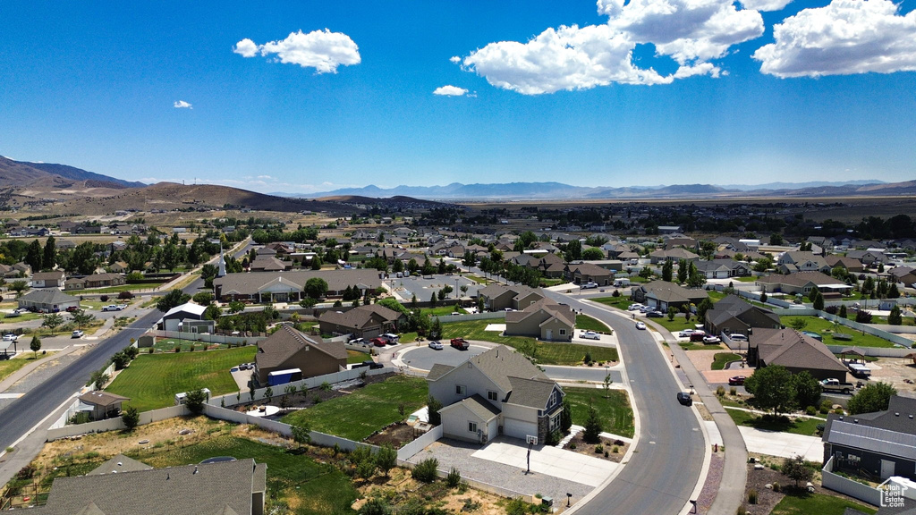 Aerial perspective of suburban area featuring a mountainous background