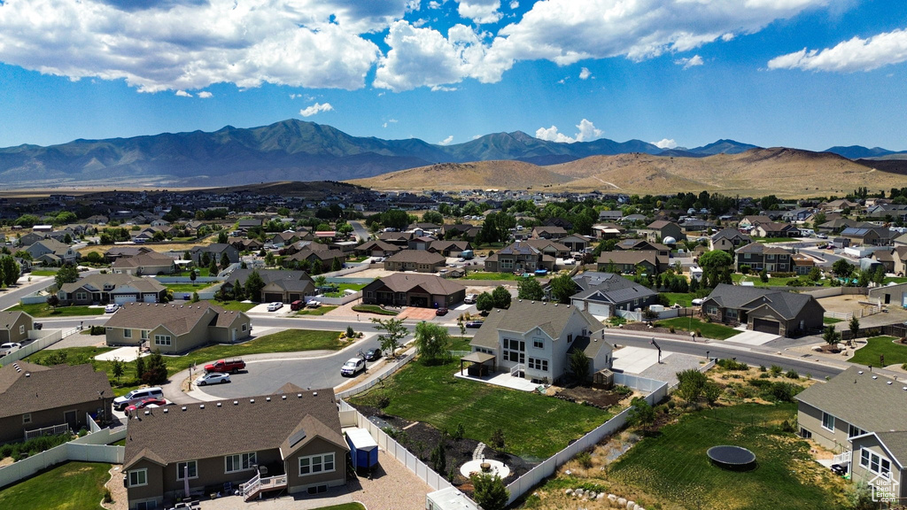 Aerial perspective of suburban area featuring a mountain backdrop