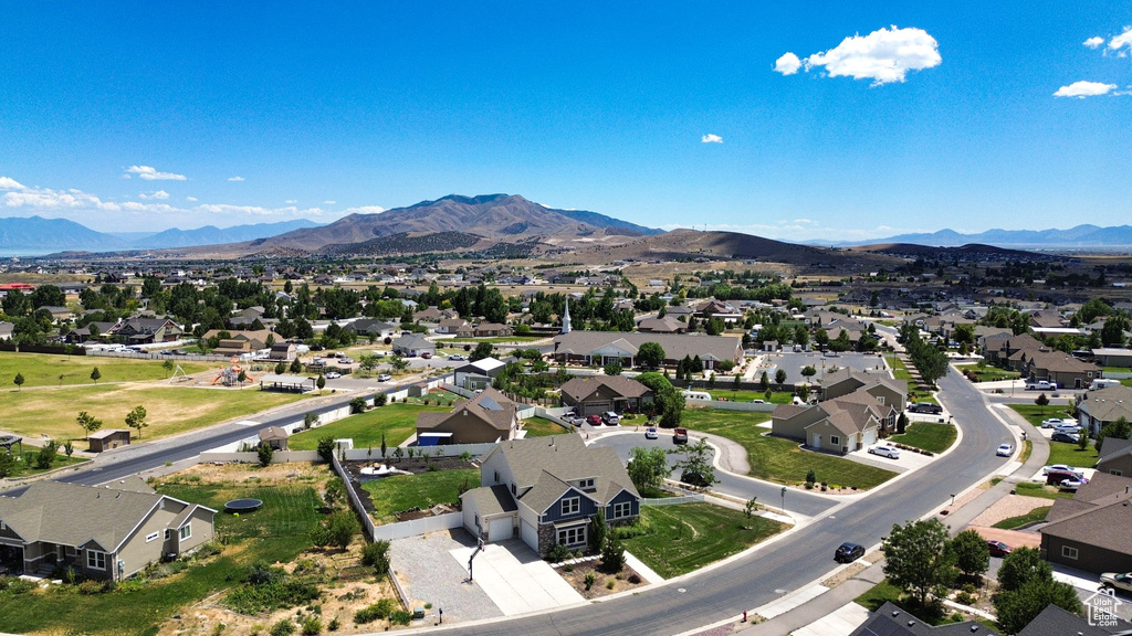 Aerial perspective of suburban area featuring a mountainous background