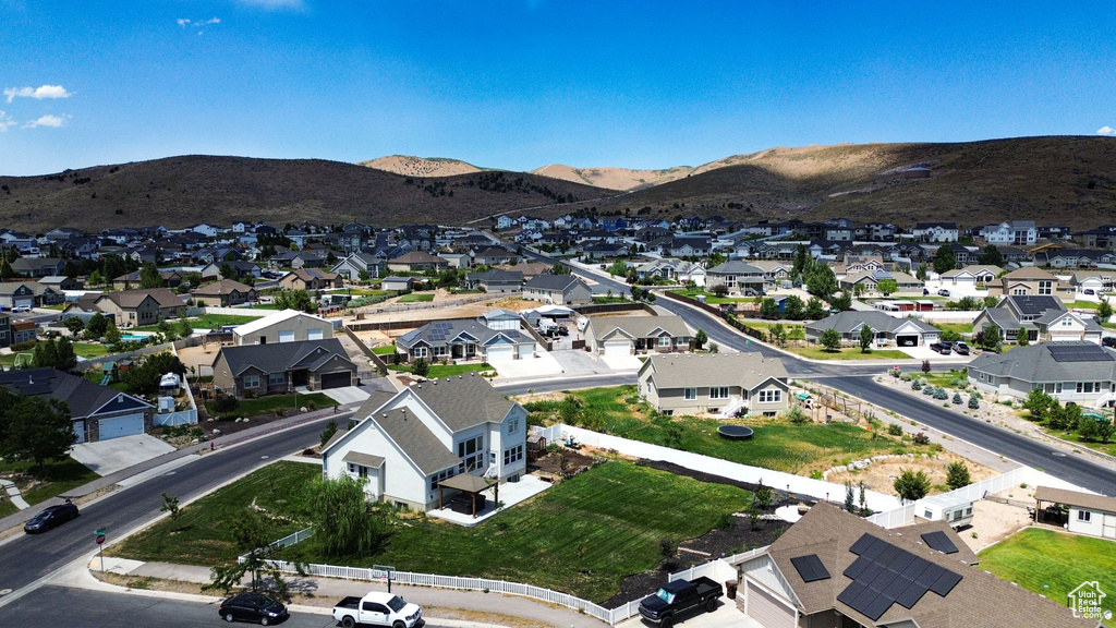 View of property location featuring nearby suburban area and mountains