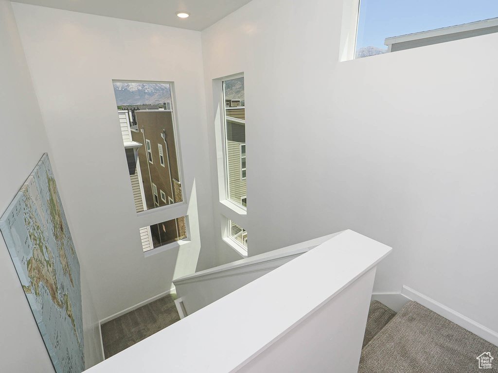 Staircase featuring carpet flooring and recessed lighting