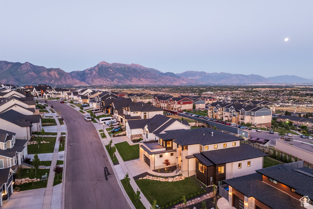 Aerial perspective of suburban area with a mountainous background