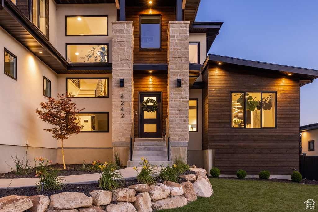 Contemporary house featuring stucco siding