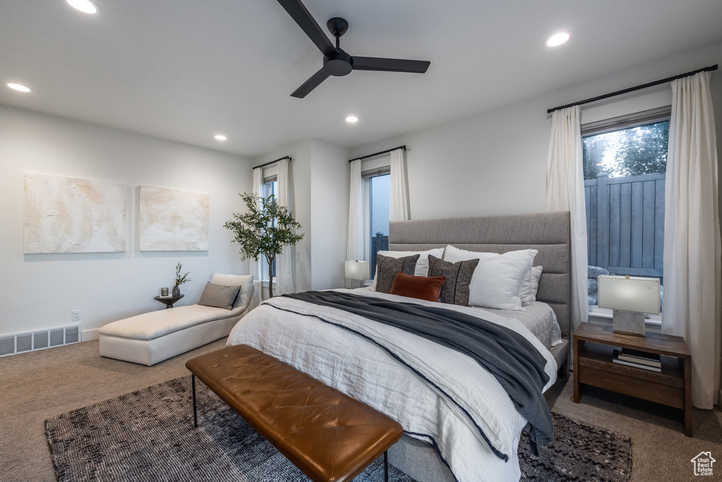 Carpeted bedroom featuring recessed lighting and a ceiling fan